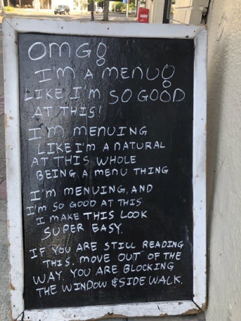 Chalkboard outside Chi's joking that it is a really good menu
