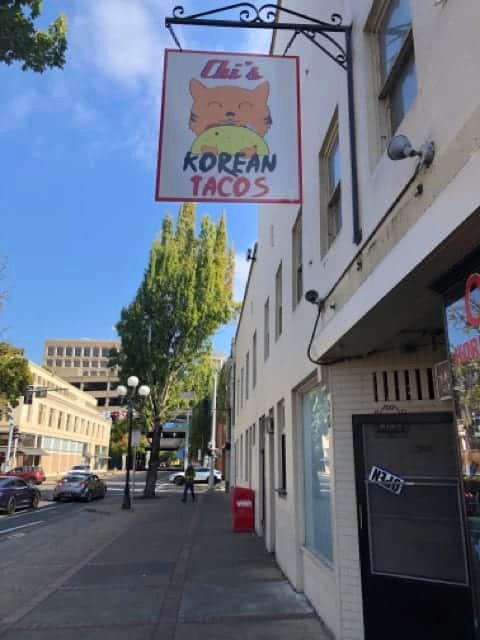 Chi's Korean Tacos sign with the orange cat mascot