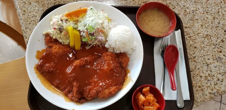 A Korean-style tonkatsu plate with rice, salad, miso soup and pickled radish