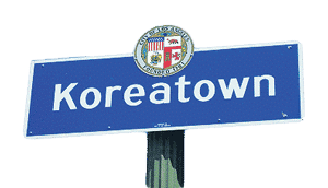 Blue Koreatown neighborhood sign with the City of Los Angeles seal